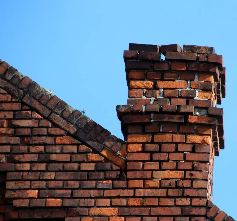 Signs Your Chevy Chase Home Needs a Chimney Inspection Damaged chimney on an Chevy Chase home showing cracks and missing mortar